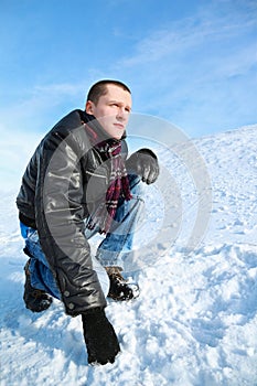 Man concentrated looks winter of squatting in sky