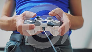 Man concept playing gamepad hands video console on tv. Hand hold new joystick playing video console on lifestyle tv