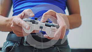 Man concept playing gamepad hands video console on tv. Hand hold new joystick playing video console on tv. Gamer play