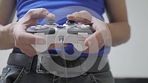 Man concept playing gamepad hands video console on tv. Hand hold new joystick playing video console on tv. Gamer play