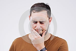 Man, confused and thinking in studio white background for doubt, choice or remember. Male person, idea or memory with