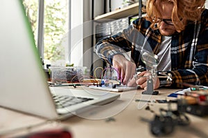 Man connect wires and cables on electro equipment