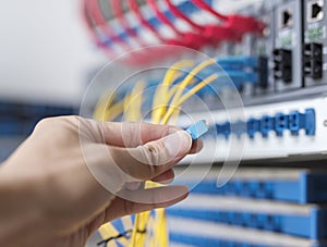 Man connecting fiber network cables