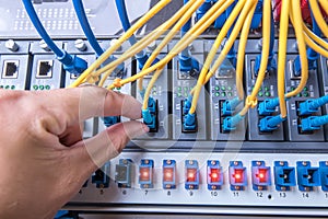 Man connecting fiber network cables