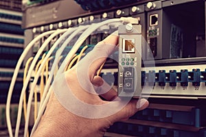 Man connecting fiber network cables