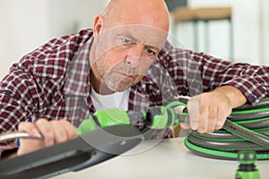 man connecting hoses photo