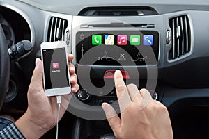 Man connecting phone to the car media system