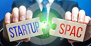 Man connects puzzles with Startup and SPAC. Simplified listing entry to stock exchange. Special purpose acquisition company