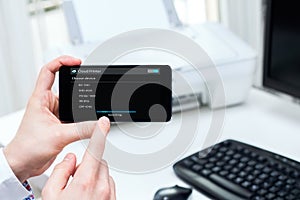 Man connects to wireless printer.