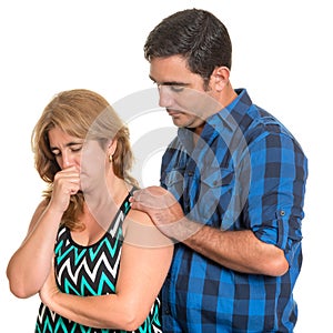 Man consoling her sad wife isolated on white
