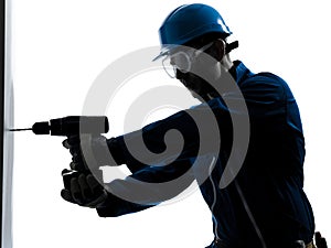 Man construction worker holding drill silhouette