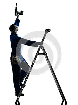 Man construction worker holding drill silhouette
