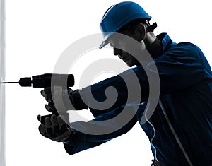 Man construction worker holding drill silhouette