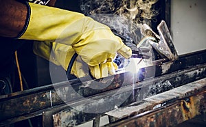 man construction worker welding metal