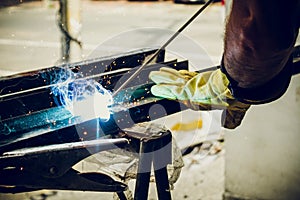 man construction worker welding metal photo