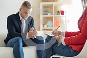 Man at consultation with psychiatrist photo