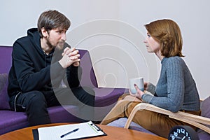 A man at a consultation with a psychotherapist, discussing his problems in the office. Social problems, depression, crisis