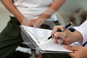 A man consults a doctor about prostate enlargement and pain from frequent urination. A young man consults with a doctor