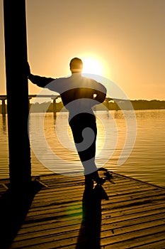 Man in contemplation, sunset photo