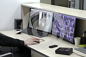 Man In Control Room Monitoring Multiple Cctv Footage