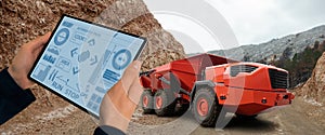 Man controls autonomous mining truck photo