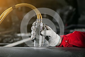 Man controls the control panel of the pneumatic, hydraulic installation