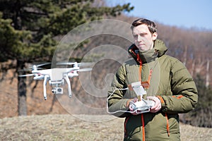 Man controls the flying drones