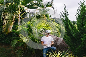 Man controls a quadrocopter