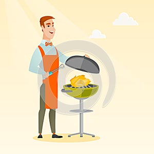 Man cooking chicken on barbecue grill.