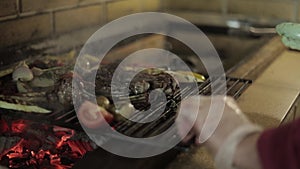 Man cooking dinner. Beef steak on grill outdoors on backyard. Raw steak. BBQ