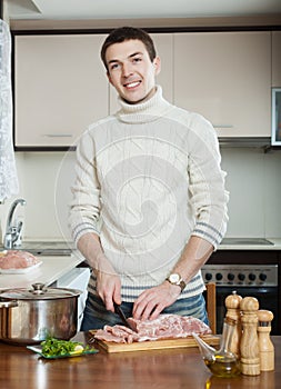 Man cooking french-style meat