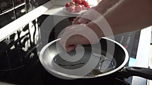 Man Cooking Fried Eggs For Breakfast On Frying Pan Closeup