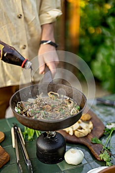 Man cooking healthy food outdoors