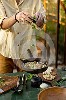 Man cooking healthy food outdoors