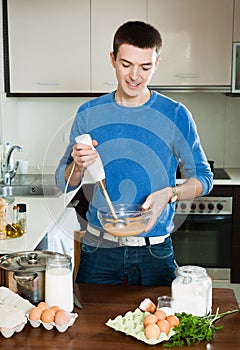 Man cooking omelet