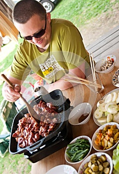 Man cooking outdoors