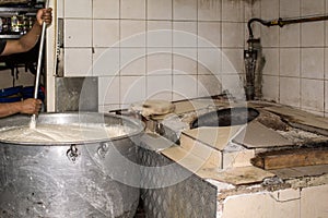 Man Cooking In A Real Grungy Dirty Restaurant Industrial & Commercial Kitchen