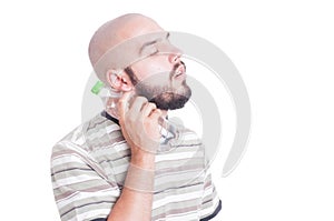 Man cooling his neck with cold water in plastic bottle