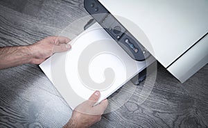 Man copying and scanning documents in office