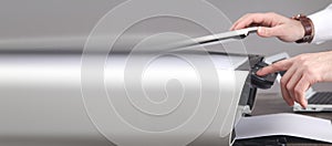 Man copying and scanning documents in office