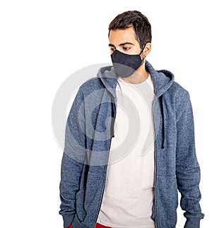 Man with coronavirus protective face mask, wearing a blank t shirt and gray color hoodie isolated against white background,