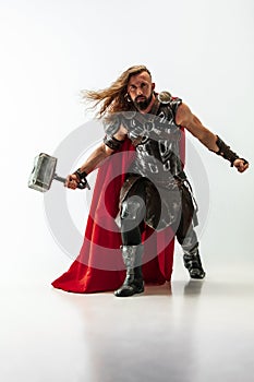 Man in cosplaying Thor isolated on white studio background