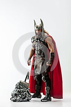 Man in cosplaying Thor isolated on white studio background