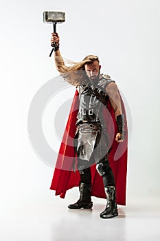 Man in cosplaying Thor isolated on white studio background photo