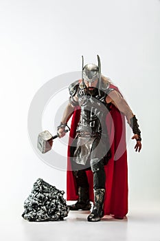 Man in cosplaying Thor isolated on white studio background photo