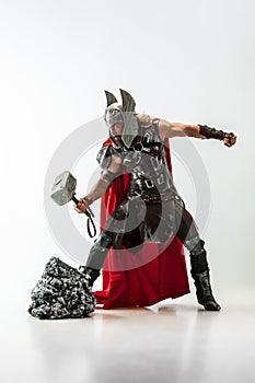 Man in cosplaying Thor isolated on white studio background photo