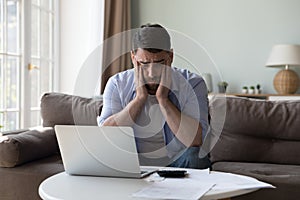 Man counted expenses looks upset because of lack of money