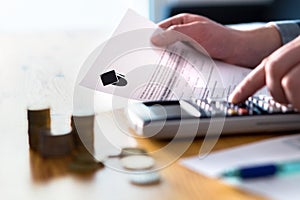 Man counting college savings fund, tuition fee or student loan.