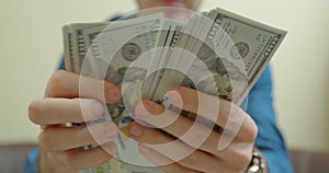 Man counting dollar bills. Close up of male hands count money cash. Money calculation. Employee salary. Cash money