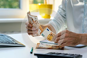 Man counting euro cash money bills